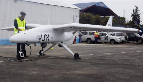 A technician checks a surveillance Unmanned Aerial Vehicles (UAV) drone operated by the United Nations in Goma