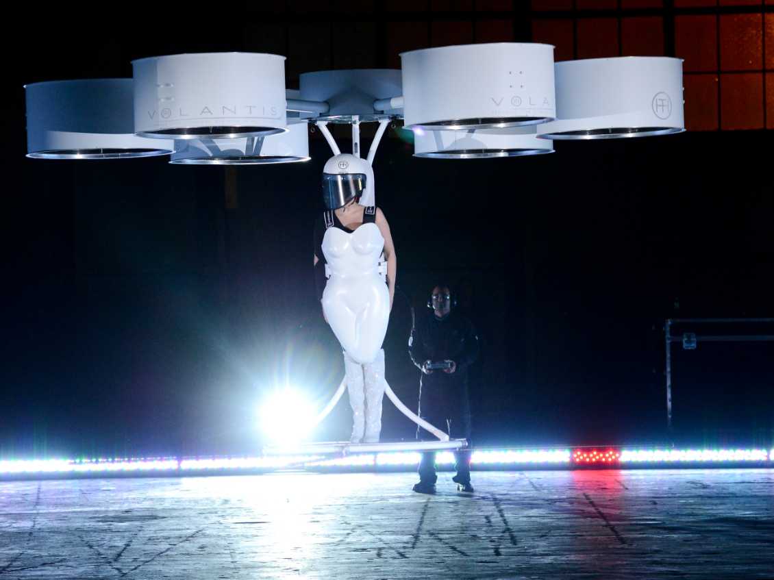 immagine di lady gaga arrived at her album release party in a half dress half drone that literally flies