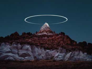 immagine di drone with led lights creates halos over rock formations 2