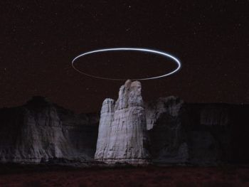 immagine di drone with led lights creates halos over rock formations 3